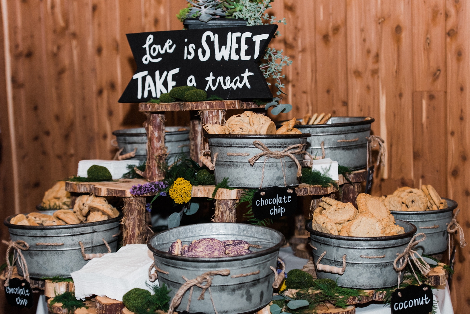 Wedding cookie dessert display in tiered, galvanized metal buckets in the Party Barn at Little Piney Lodge in Hermann, MO