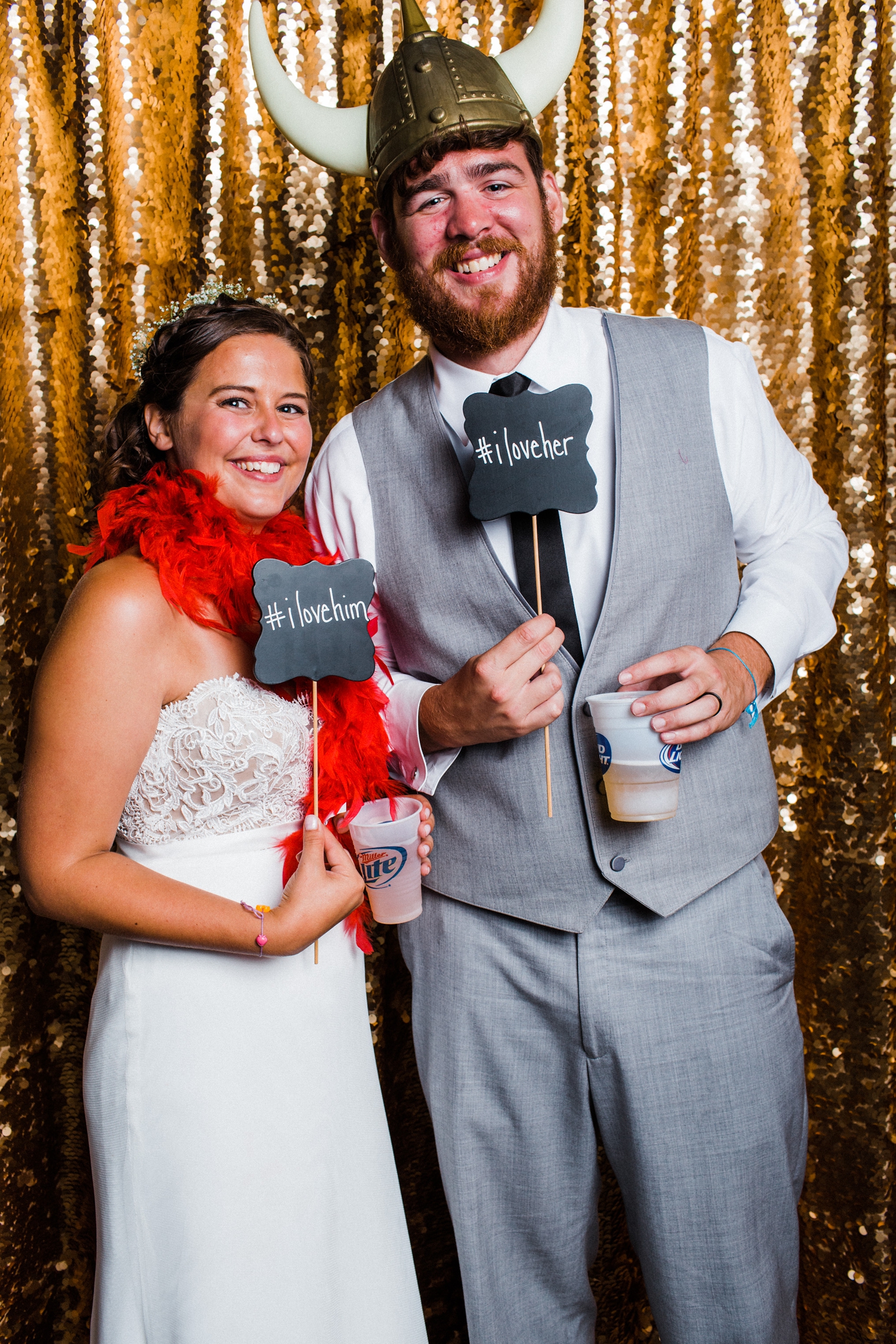 Bride and groom in gold sequin photo booth at Little Piney Lodge in Hermann MO. 